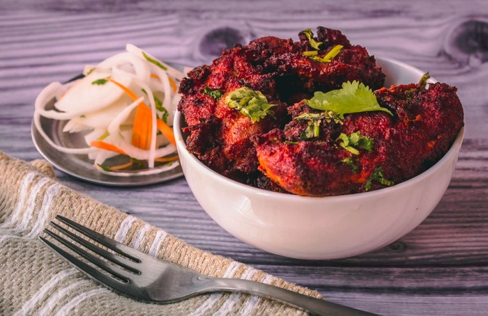 Deep-fried chicken marinated in a blend of secret spices and yogurt